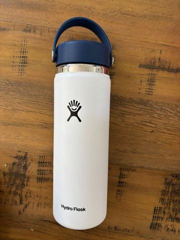 Before: the bottle photographed on a wooden table